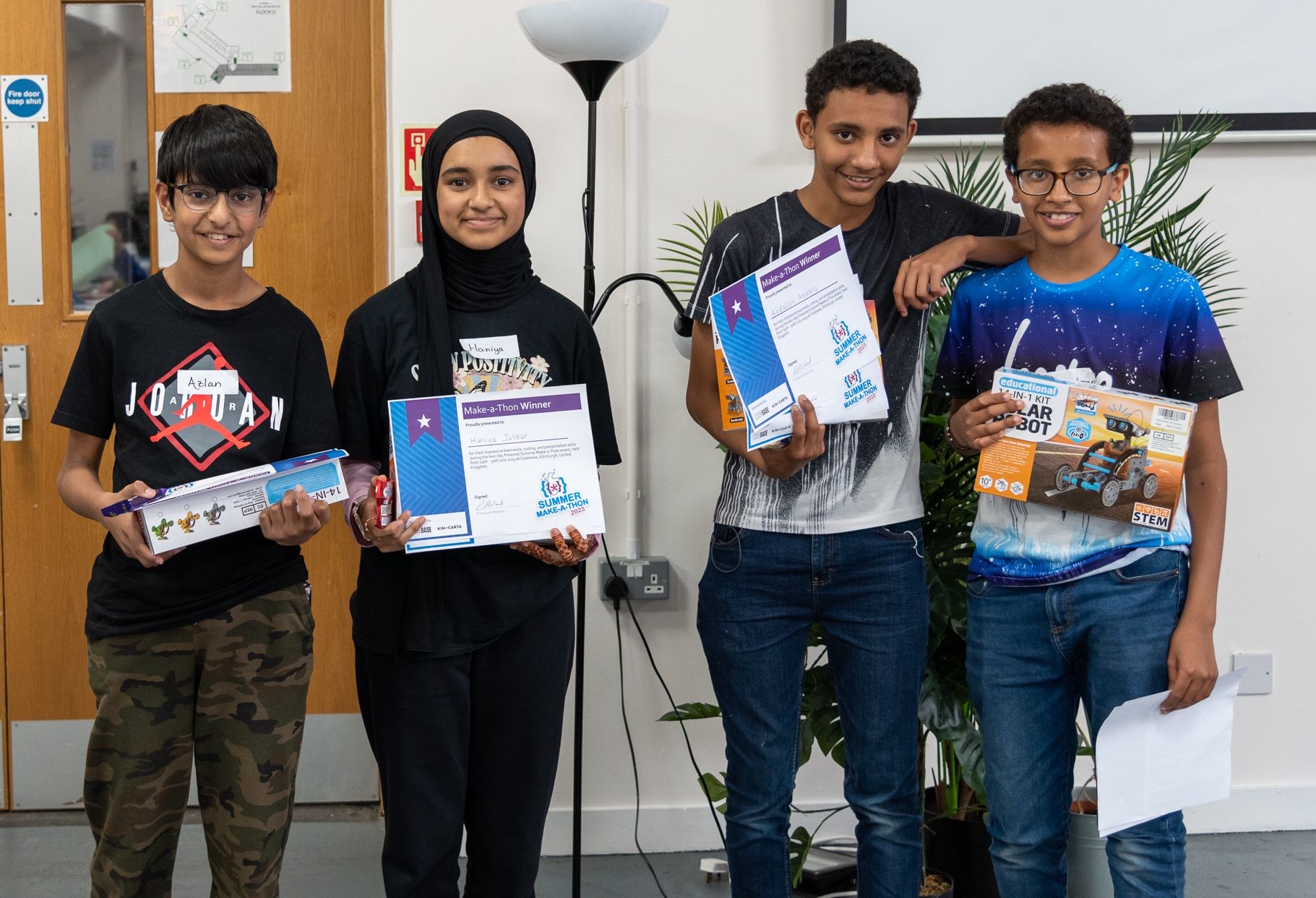 The four winners of the Make-a-Thon presenting their awards and prizes