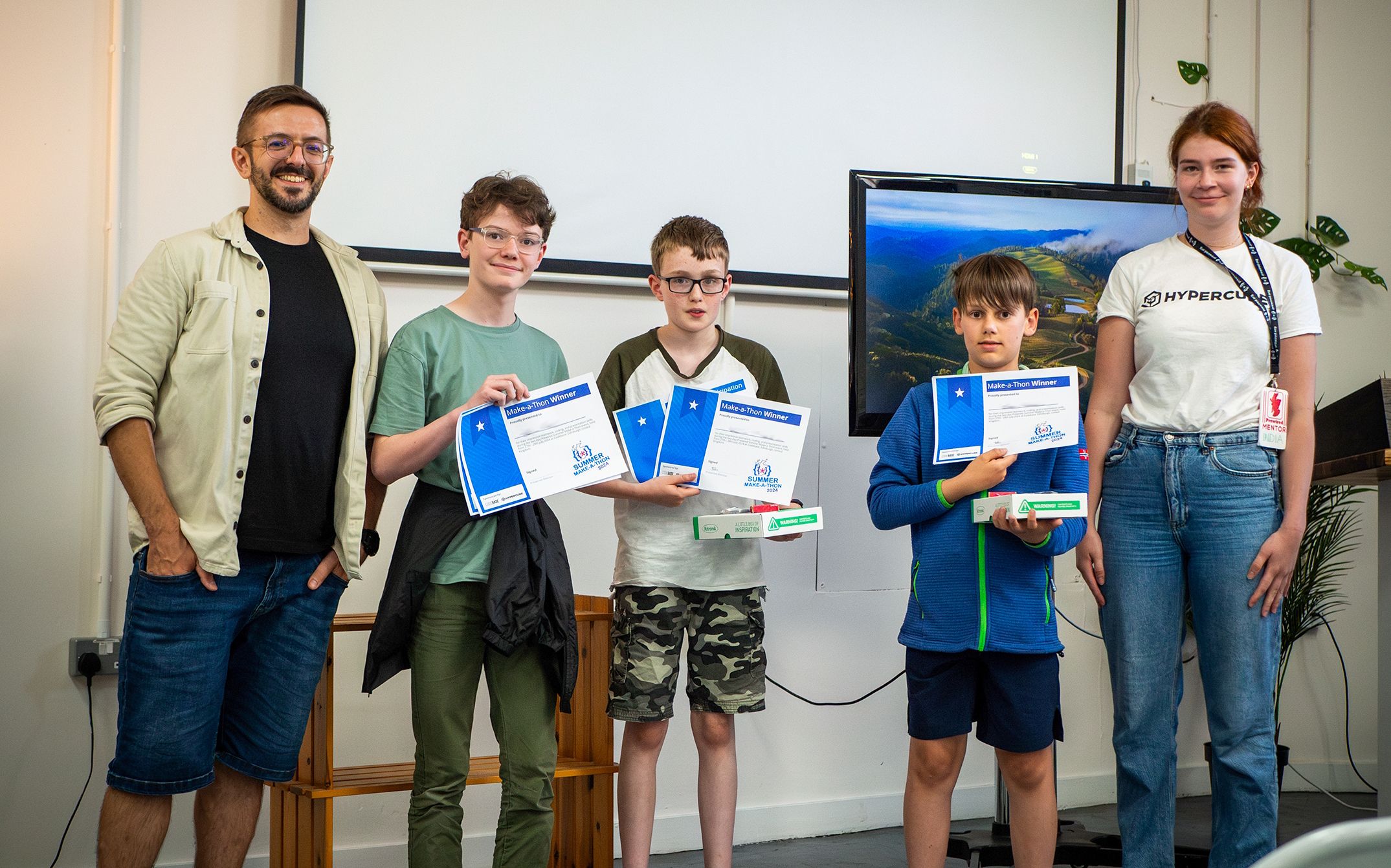 The three winners of the Make-a-Thon presenting their awards and prizes together with a Prewired mentor and competition judge