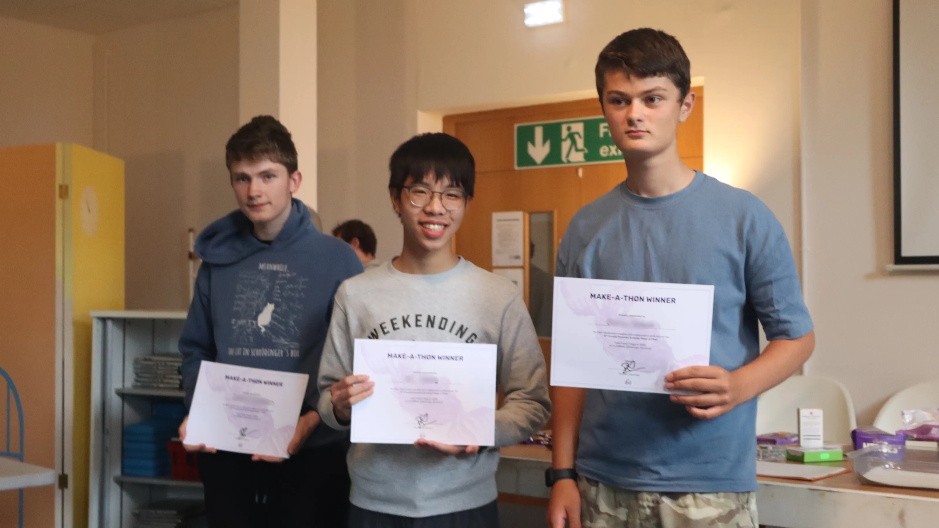 Team KSJ posing with their winner certificates
