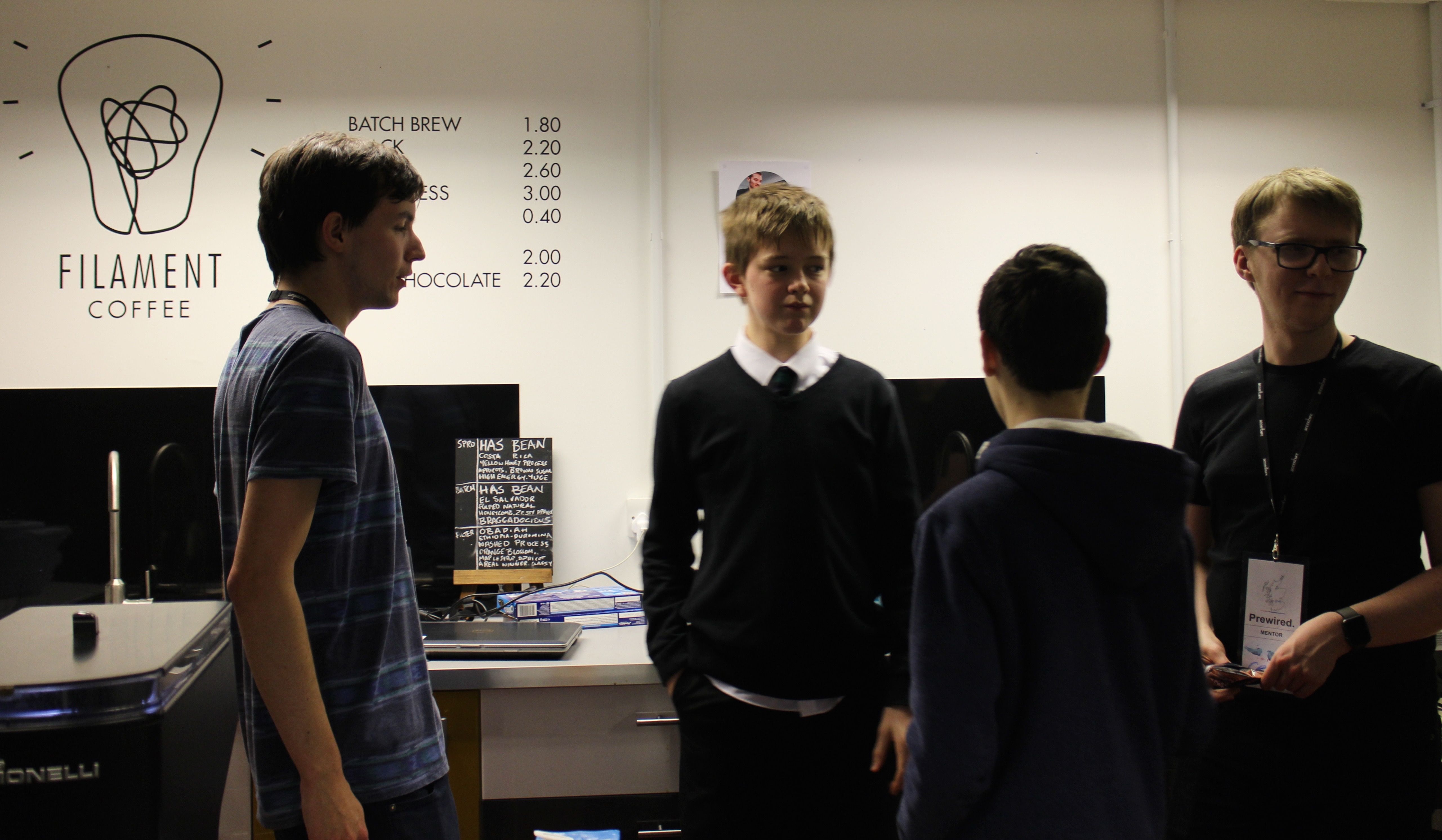 Two attendees and two mentors chatting in a coffee corner
